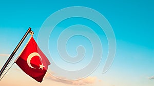 Turkish flag against the azure blue sky