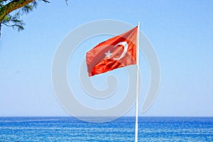 Turkish flag on the background of the sea.