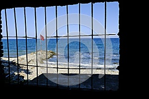 Turkish flag behind bars