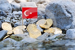 Turkish flag with euro currency coins on the riverbank,business concept photo