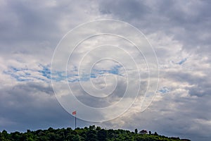 The turkish flag flagging above the trees photo