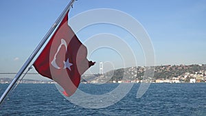 Turkish flag waving on a boat in Bosphorus strait, Istanbul, Turkey