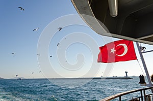 The Turkish flag is waving on the ferry,..