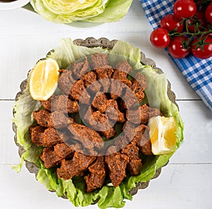 Turkish Food Cig Kofte with lemon, lettuce and parsley