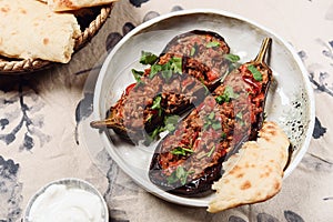 Turkish food: halves of baked eggplant stuffed with vegetables