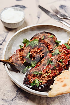 Turkish food: halves of baked eggplant stuffed with vegetables