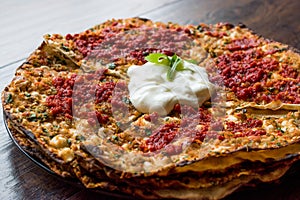 Turkish Food Kayseri YaÃÅ¸lama with Minced Meat, Yogurt and Tomate Paste. photo