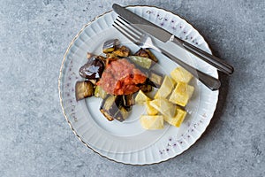 Turkish Food Kizartma / Fried Aubergine or Eggplant Slices with Tomato Paste Salsa Sauce and Cube Potatoes.
