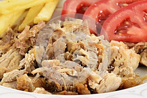 Turkish kebab with french fries and tomatoes