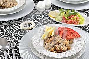 Turkish kebab with french fries and tomatoes