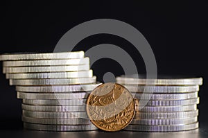 Turkish Kurush Gold Coin in front Silver Coins