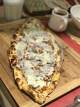 Turkish Lahmacun on the wood plate