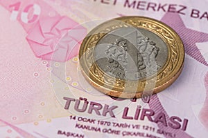 Turkish Lira banknote with one lira coin