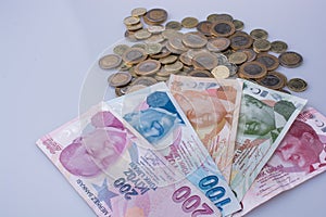 Turkish Lira coins and banknotes side by side