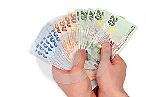 Turkish lira held on a white background