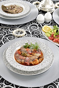 Turkish meat stew with french fries and tomatoes