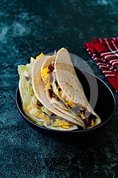 Turkish Mexican Style Taco Cig Kofte with Kidney Beans, Red Onions, Grated Cheddar Cheese and Pomegranate Syrup Sauce