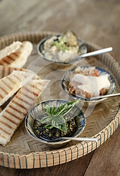 Turkish meze vegetarian tapas snack platter on rustic wood table