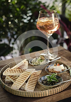 Turkish meze vegetarian tapas snack platter on rustic wood table