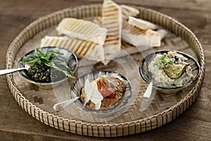 Turkish meze vegetarian tapas snack platter on rustic wood table