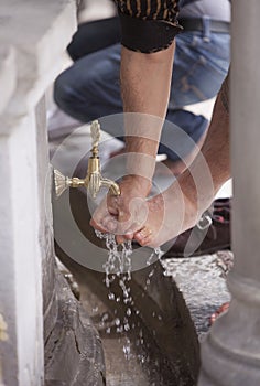 Turkish Muslim Man washing Feet