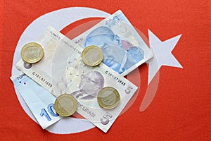 Turkish national currency lira on turkish flag