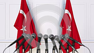 Turkish official press conference. Flags of Turkey and microphones. Conceptual 3D rendering