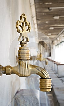 Turkish Ottoman style antique ablution tap at the ablution fountain in front of Sultan Ahmed Mosque, Istanbul, Turkey