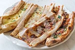 Turkish Pastry Konya Mevlana Pide with Cubed Meat and Melted Cheese.