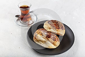 Turkish Pastry Pogaca with Tea / Cay on white wooden surface. Traditional Bakery