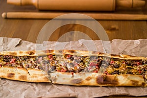 Turkish pide with cheese and cubed meat / kusbasili kasarli pide.