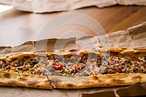 Turkish pide with cheese and cubed meat / kusbasili kasarli pide.