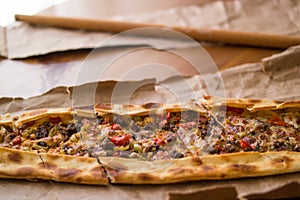 Turkish pide with cheese and cubed meat / kusbasili kasarli pide.