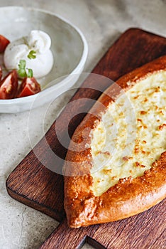 Turkish pide with cheese - Kasarli Pide and tomatoes with burrata cheese