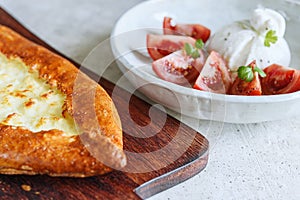 Turkish pide with cheese - Kasarli Pide and tomatoes with burrata cheese
