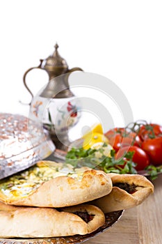 Turkish Pide with ibrik and vegetables photo