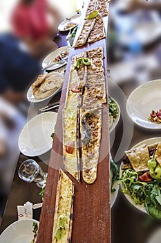 Turkish Pide served on long planks