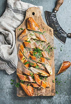 Turkish pizza pide with cheese and spinach chopped in slices