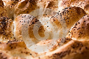 Turkish Ramadan Bread - Ramazan Pidesi on wooden surface / Pide photo