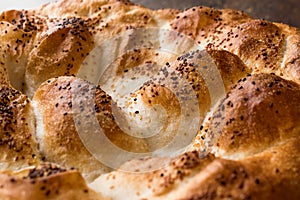 Turkish Ramadan Bread - Ramazan Pidesi on wooden surface / Pide photo