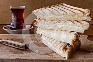 Turkish Sandwich Toast Tost with cheddar or melted cheese and tea photo