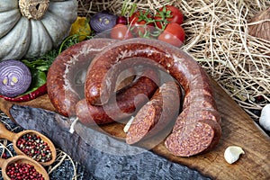 Turkish sausage kangal sucuk. Sujuk sucuk, a dry spicy sausage on wooden background