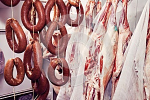 Turkish sausage and lamb meat carcass in the cold storage room