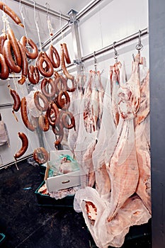 Turkish sausage and veal meat carcass in the cold storage room