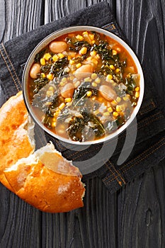 Turkish soup lahana corbasÄ± Tarifi turkish soup with kale, beans and corn close-up in a bowl. vertical top view