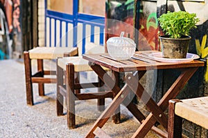 Turkish street cafe in Istanbul. Wooden table and chairs stand directly on the street. A distinctive and authentic place