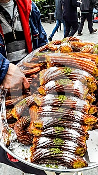 Turkish Street Dessert Kivrim or halka tatlisi with sherbet.