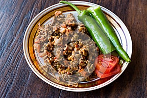 Turkish Street Food Kokorec with Tomato and Green Pepper. Portion Sheep Bowel.