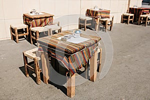 Turkish street street coffees in Istanbul. Wooden tables and chairs stand directly on the street. A distinctive and