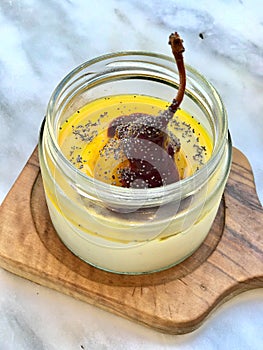 Turkish Style Custard Pudding Dessert with Safflower, Pear, Salep / Sahlep and Poppy Seeds in Jar